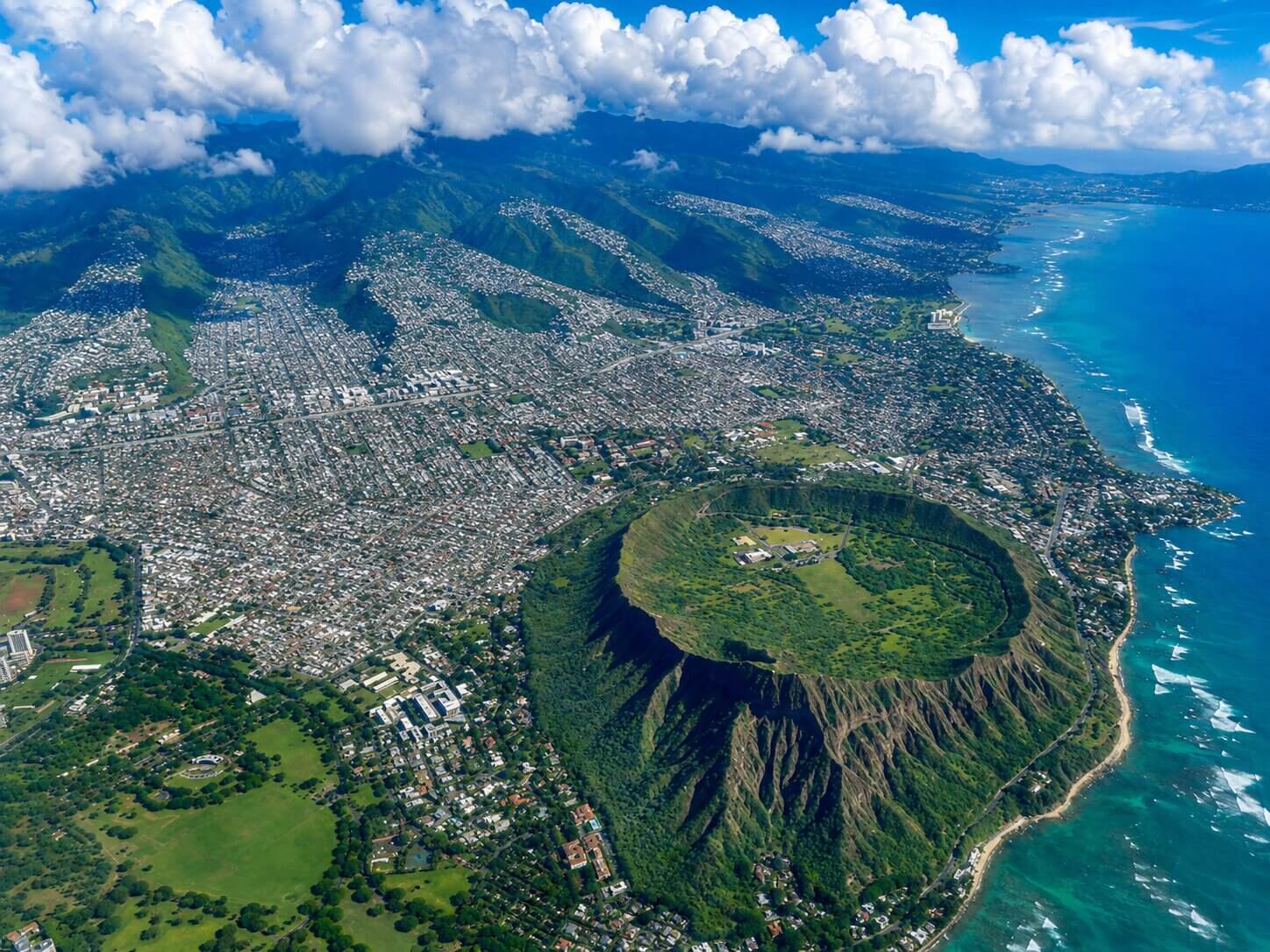 Aerial view of Diamond Head crater above Honolulu and the Oahu coastline