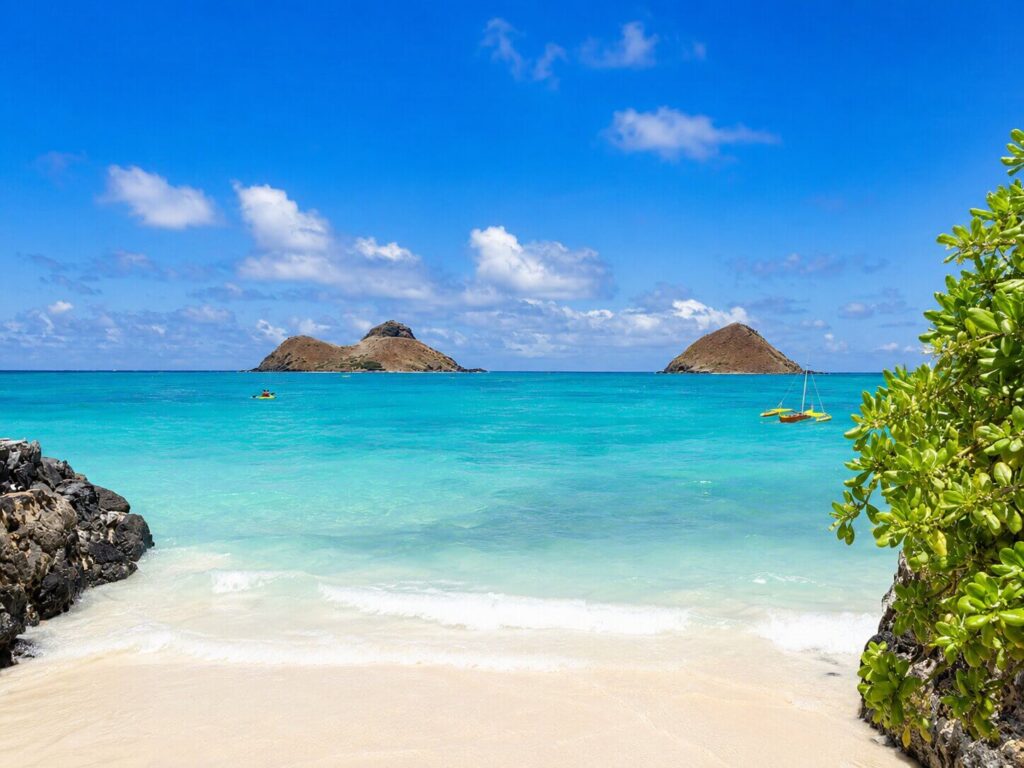 Lanikai Beach with white sand and the two Mokulua offshore islands